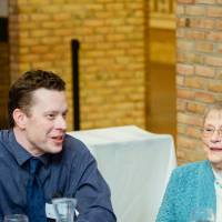 Two guests sitting together at Scholarship Dinner 2019